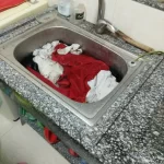 Wash clothes in sink